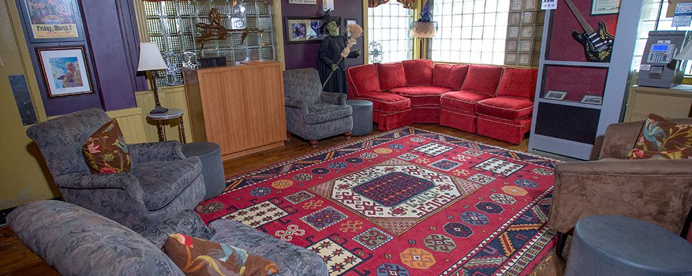 front lobby lounge with sofas chairs and phone booth